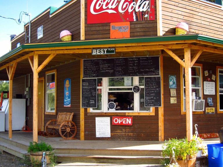 wooden storefront with prominent open sign