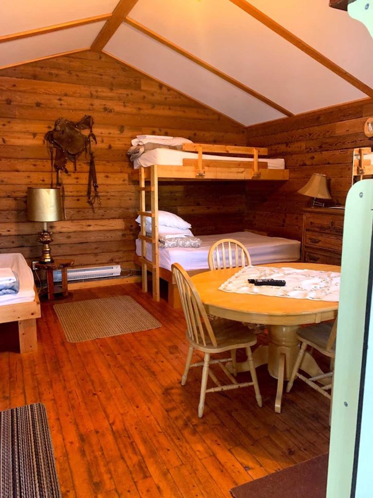 room inside a wooden cabin, with bunk beds